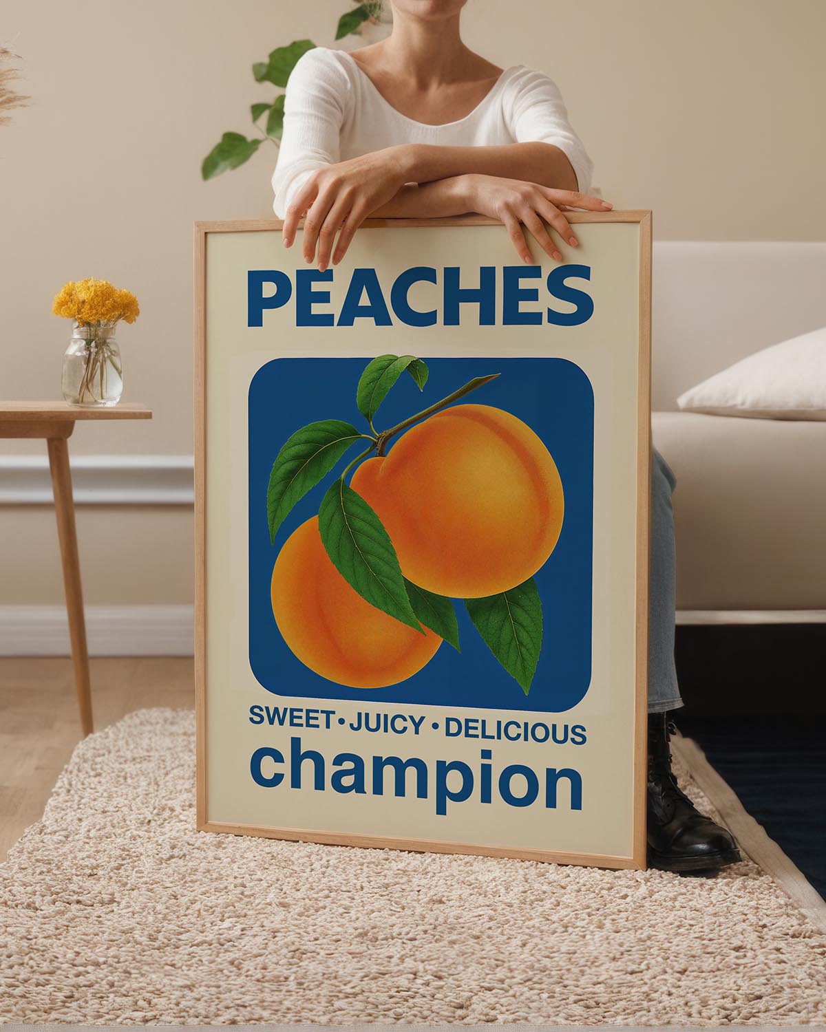 Vintage-style poster featuring two ripe peaches with green leaves on a blue background. Bold text reads "PEACHES" at the top and "SWEET • JUICY • DELICIOUS champion" at the bottom.