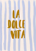 A poster featuring the phrase "La Dolce Vita" in bold, mustard-yellow lettering centered on a background with vertical, pale blue and white brushstrokes, creating a relaxed yet cheerful vibe.
