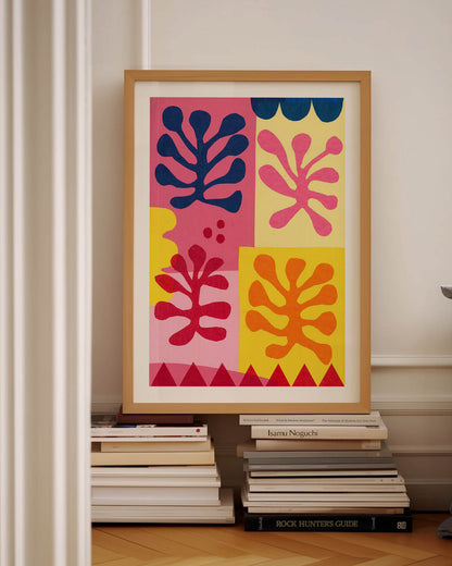 Colorful art poster inspired by Matisse's cutouts, featuring abstract leaf shapes in pink, yellow, navy, and red, set against a playful multi-colored background, perfect for adding a modern art vibe to any space.