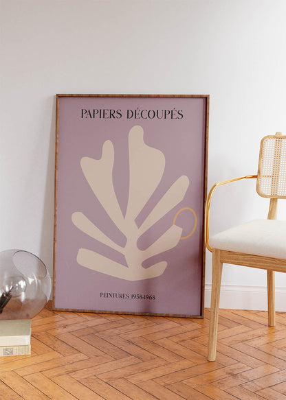 Minimalist purple poster featuring Matisse-inspired 'Papiers Découpés – The Cut-Outs' artwork with abstract beige shapes and a golden ring, inscribed with 'PEINTURES 1958-1968' for an artistic and historical ambiance