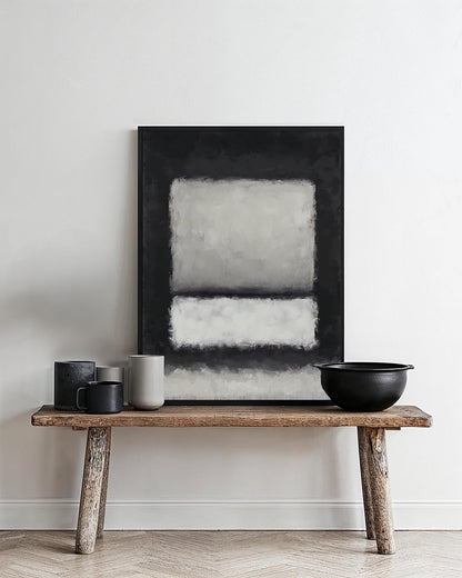 Abstract painting with two soft white rectangles framed in dark charcoal, creating a calm, minimalist composition