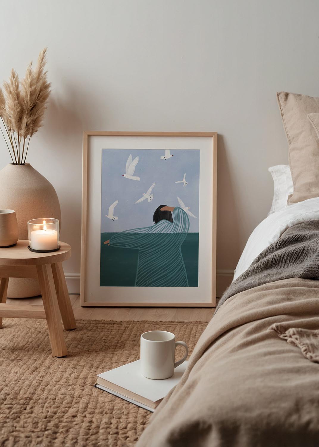 Illustration of a woman looking at flying seagulls, her striped robe blending into the ocean, under a pale blue sky – art print by Bea Müller.