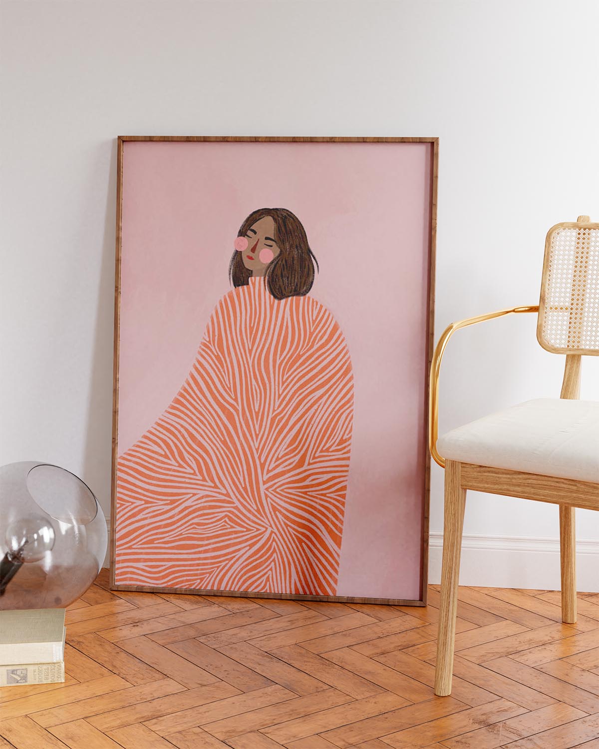 Illustration of a woman with closed eyes wearing a coral and cream swirl-patterned cloak, set against a pink background – art print by Bea Müller.