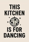 Black and white poster with bold text that reads “This Kitchen is for Dancing,” featuring a disco ball illustration in the center.