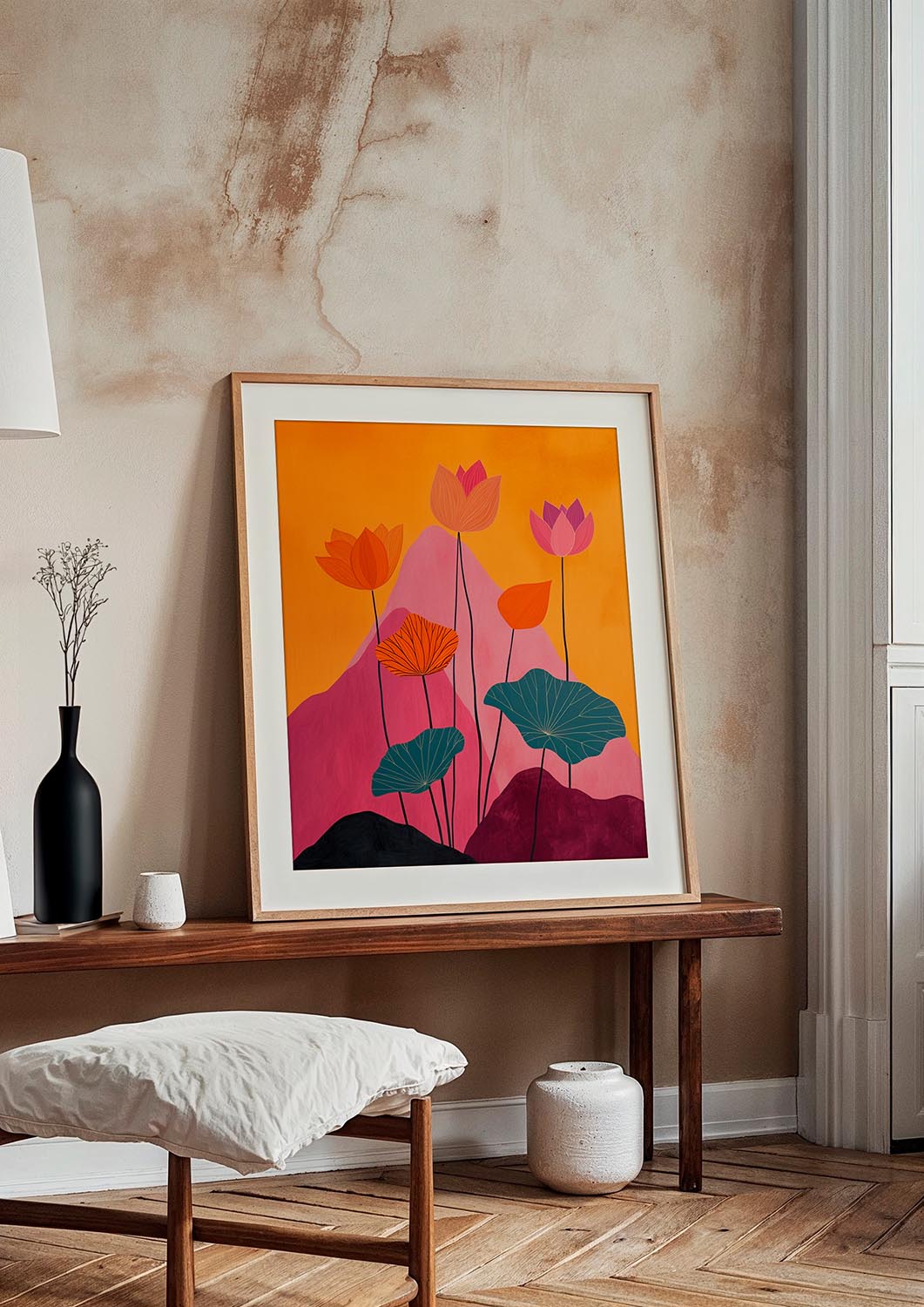 Stylized illustration of tall lotus flowers in orange and pink, with broad teal leaves and dark mountains, against a mustard yellow background.