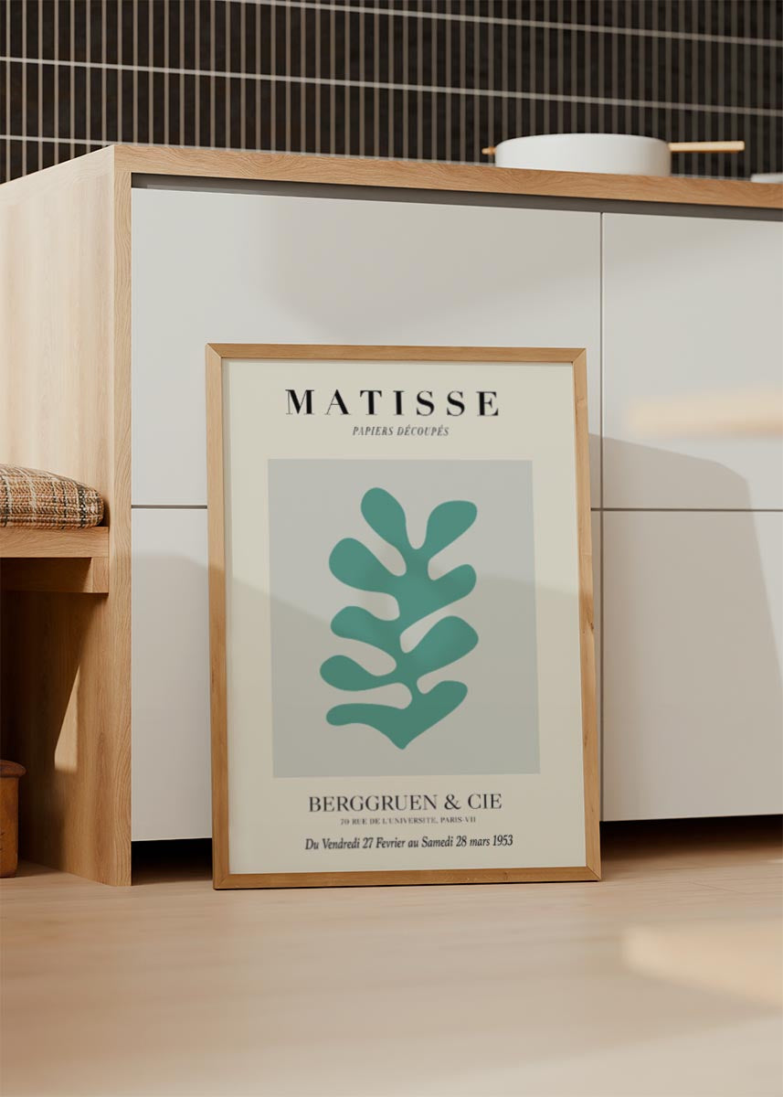 Minimalist Matisse poster featuring a teal abstract leaf shape with French text from a 1953 Paris exhibition.
