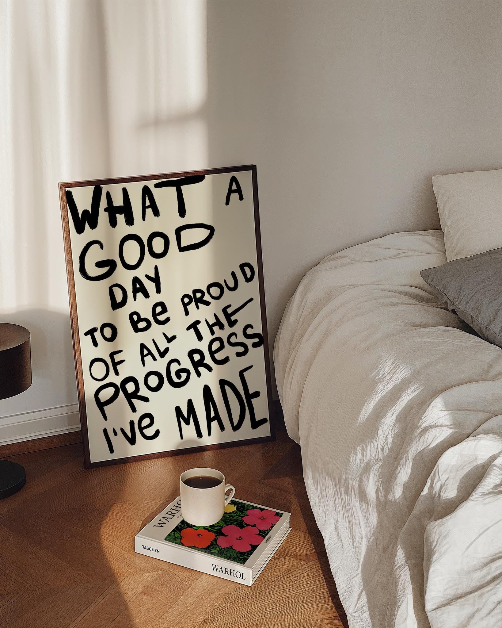 Hand-drawn typography poster with bold black brushstroke text reading, "What a good day to be proud of all the progress I’ve made," on a light background. Motivational and expressive design.