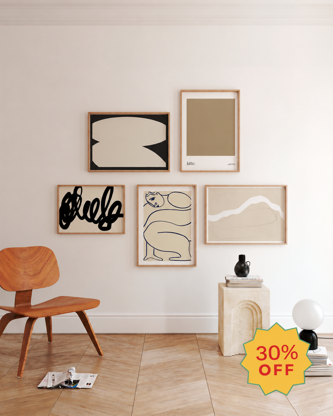 The Neutral Edit gallery wall set featuring five framed abstract art prints in beige, cream and black, displayed in a modern neutral living room with natural wood accents.