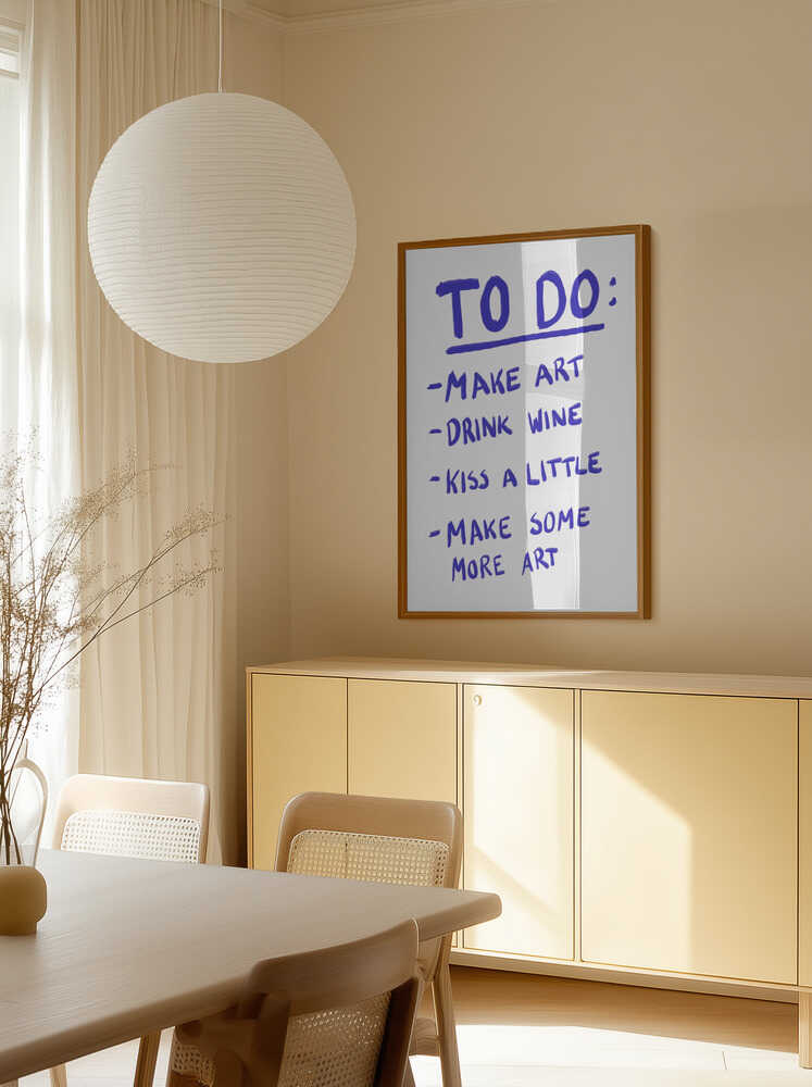Handwritten poster with a playful to-do list in bold purple text: "Make art, drink wine, kiss a little, make some more art" on a white background.