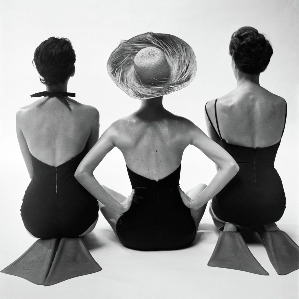 Back view of fashion models in swim suits poster